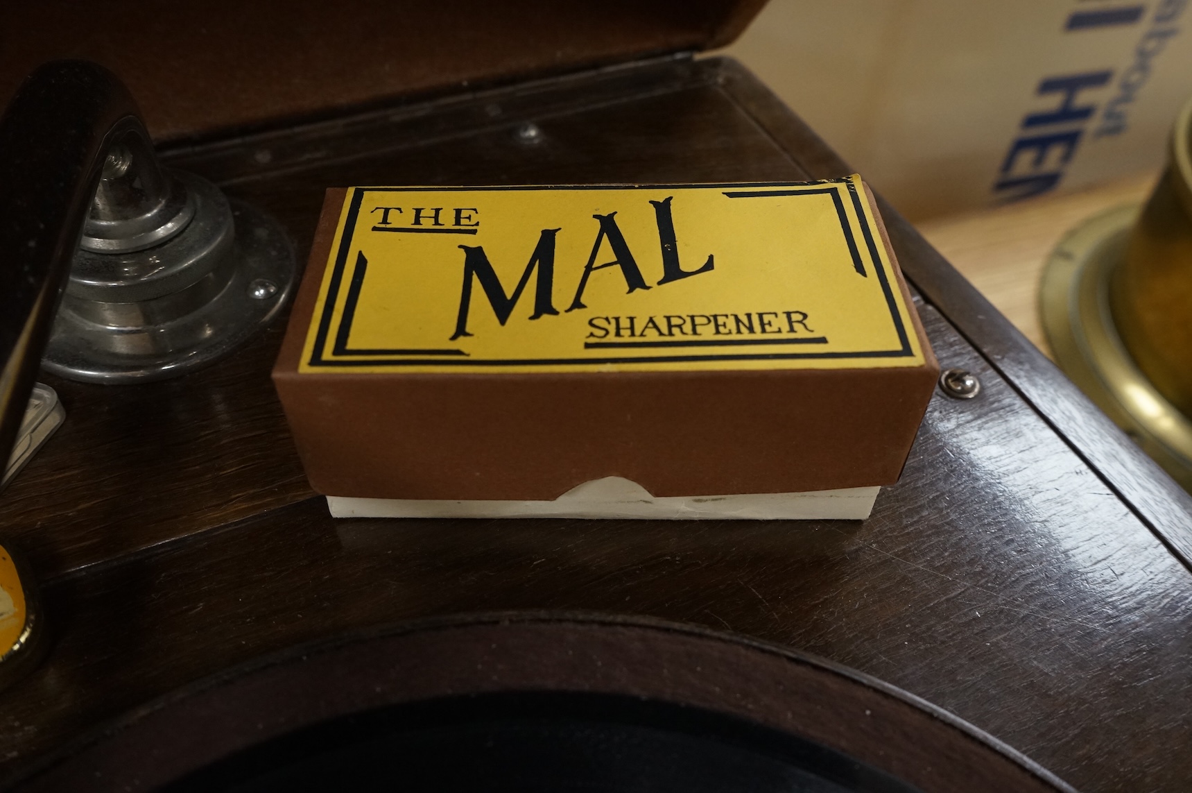 An EMG ‘Handmade Gramophone’ with electrically powered motor, in an oak veneered case with large papier-mâché horn, dimensions of the case; 44 x 53 x 27cm, diameter of the horn 56cm.